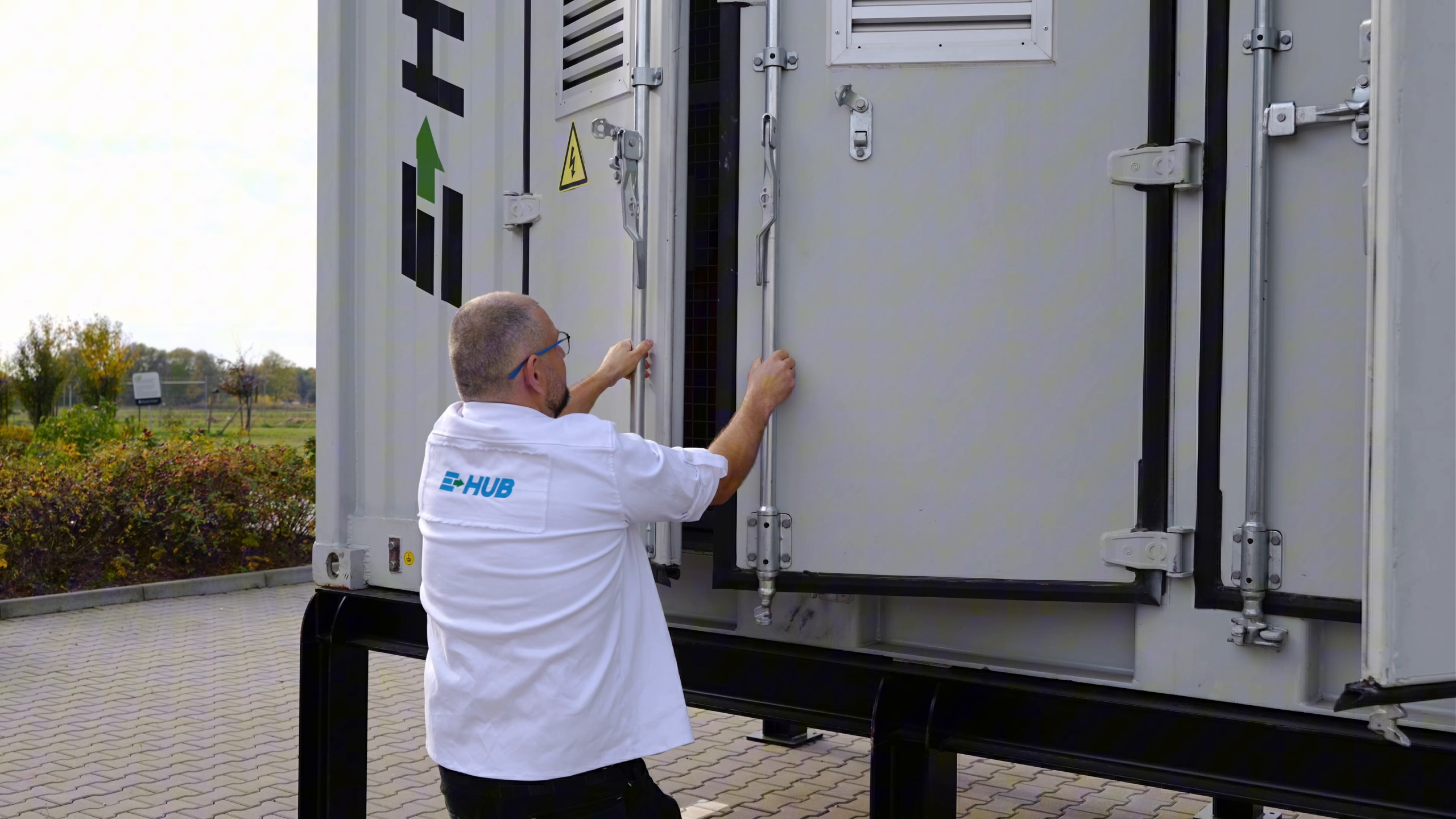 Technician servicing E-HUB storage equipment